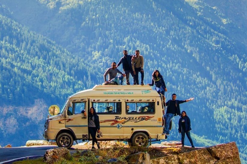 Travelers on a mountain road trip with The Explorers
